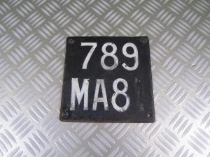 Licence plate holder. (b)